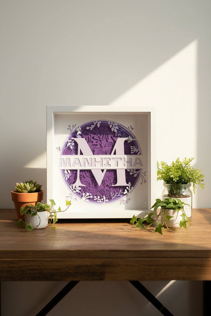 Framed paper cutout with decorative text and design on a neutral background